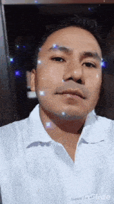 a man in a white shirt is taking a selfie with inslide written on the bottom right