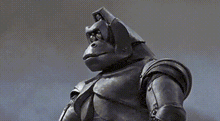 a statue of a gorilla with a helmet on its head .