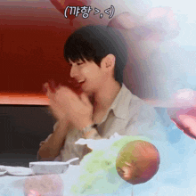 a man sitting at a table with balloons behind him and a caption that says ( tf )