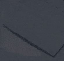 a person laying on a bed in a dark room with arrows on the wall