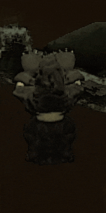 a cartoon drawing of a monster with big teeth standing in the dark