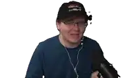 a man wearing a black hat that says shark tank