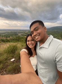a man and a woman are posing for a picture together