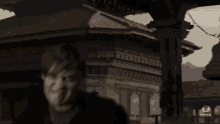 a blurred image of a man with the word mork on the bottom right
