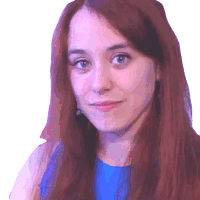 a woman with long red hair wearing a blue shirt