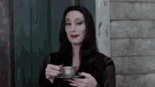 Sip Of Tea - The Addams Family GIF - The Addams Family Morticia Addams Coffee GIFs
