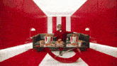 a man sits on a couch surrounded by buckets of kfc