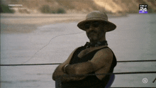 a man wearing a hat and sunglasses is sitting on a boat in front of a screen that says digi 24 hd