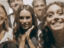 a group of people are posing for a picture with the words margarita.gif visible in the corner