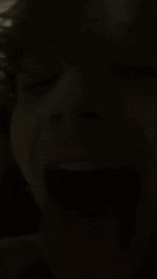 a close up of a person 's tongue sticking out