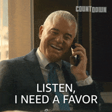a man in a suit and tie talking on a cell phone with the words listen i need a favor