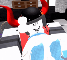 a white cartoon character with red horns and a black hat is sitting on a chair