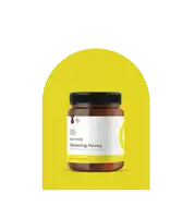 a bottle of essenzo slimming honey is displayed on a yellow background