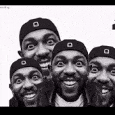 a black and white photo of a group of men wearing black hats