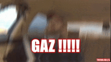 gaz !!! is written in red on a blurry picture