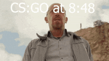 a man stands in front of a cloudy sky with the words cs go at 8:48 on the bottom