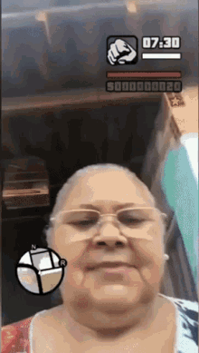 an older woman wearing glasses is playing a video game with a time of 07:30
