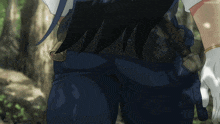 a close up of a person 's butt with a sword in the back