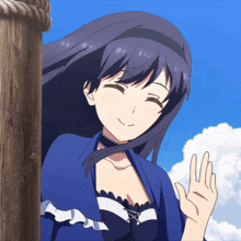 a girl with long dark hair is smiling and waving