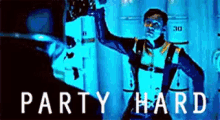 a man in a scuba suit is standing in a dark room with the words party hard written on the bottom