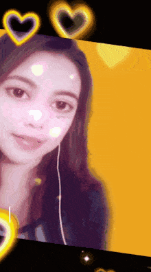 a close up of a woman 's face with hearts around it
