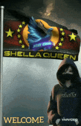a woman in a black hoodie is standing in front of a flag that says shella queen