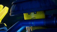 a close up of a lego figure with his eyes closed and a smile on his face