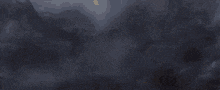 a silhouette of a dragon flying in the sky with its wings spread .