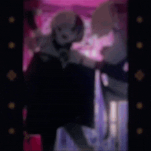 a blurry picture of a person standing in a room .