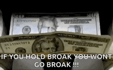 a bunch of money is stacked on top of each other .