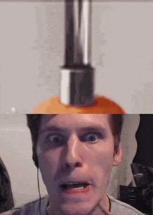 a close up of a man 's face with a bottle of lotion in the background