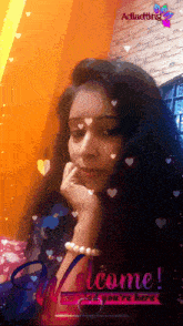 a woman 's face is surrounded by hearts and says welcome