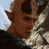 a close up of a man 's face with horns on his head