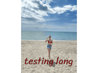 a woman in a bikini stands on a sandy beach with the words testing lang written in red