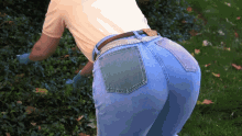 big butt ass bent over tight pants gardening