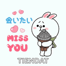 a cartoon rabbit is holding a hat and scarf and says " miss you tiendat "