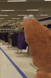 a cartoon character is standing in a store with clothes on display