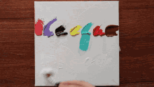 a palette of acrylic paints on a white surface