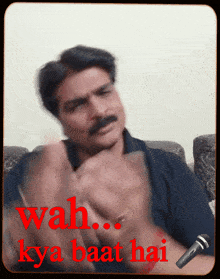 a man sitting on a couch with the words wah kya baat hai