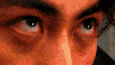 a close up of a person 's eyes with a red glow