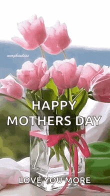 a vase filled with pink flowers with the words `` happy mother 's day love you more '' .