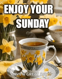 a cup of tea with daffodils on it is on a saucer on a table with flowers .