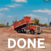 a red dump truck is driving down a dirt road with the word done written below it