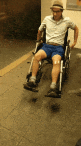a man is sitting in a wheelchair with a bandage on his leg