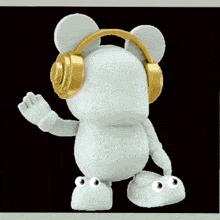 a white teddy bear wearing gold headphones on its head