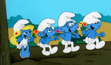 a group of smurfs are standing next to each other holding flowers
