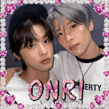 two young men are posing for a picture with the word onri written in pink letters