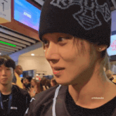 a man wearing a black beanie has the name orbitseoks on the bottom
