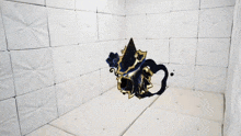 a room with white tiles and a black and gold object on the floor