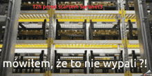 a warehouse with a sign that says " 12h przed startem soronet3 "